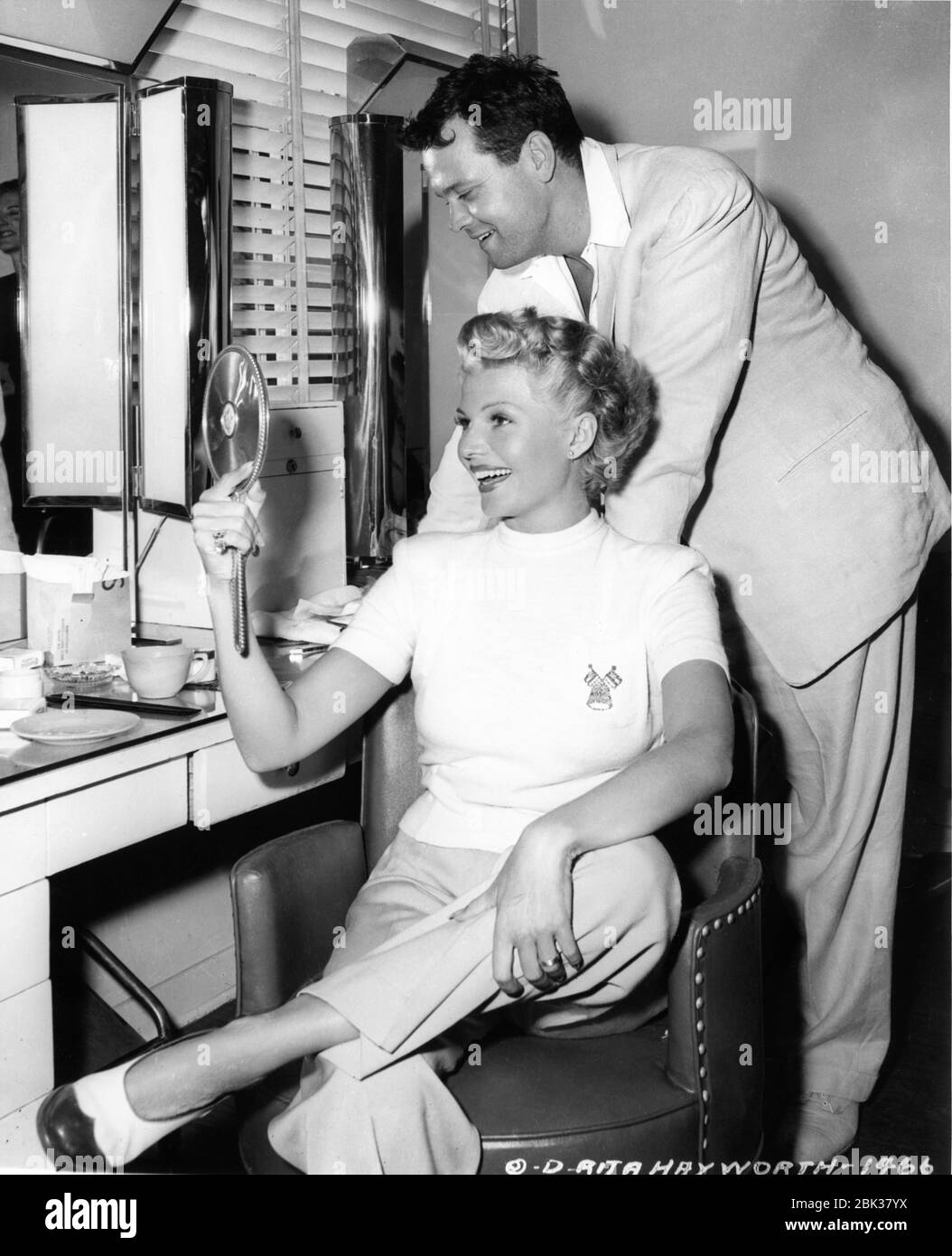 RITA HAYWORTH getting hair cut and dyed blonde candid with ORSON WELLES  during production of THE LADY FROM SHANGHAI 1947 director / screenplay  ORSON WELLES based on novel by Sherwood King gowns