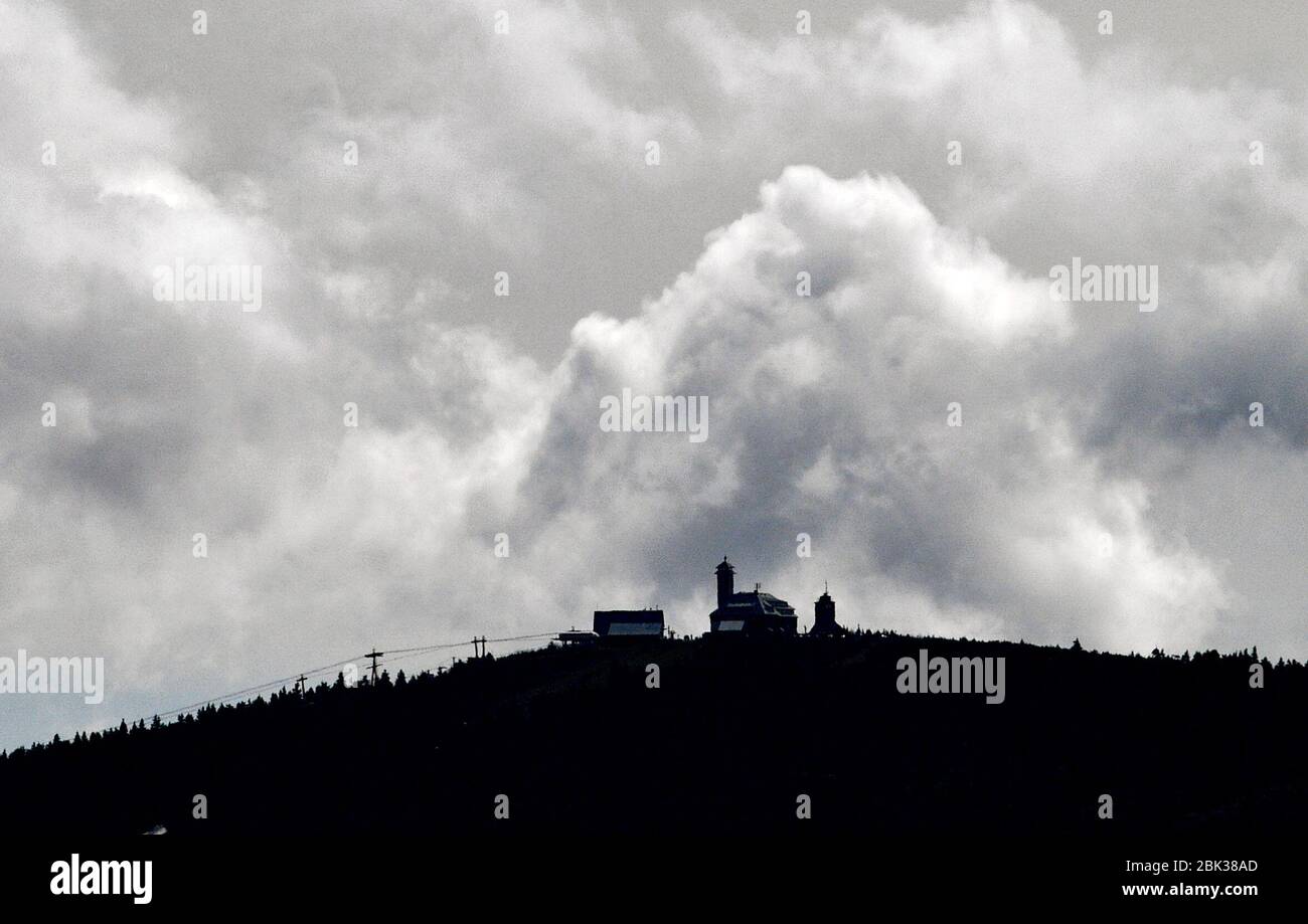 01 May 2020, Saxony, Bärenstein: Rain clouds move over the 1215-meter-high Fichtelberg. Photo: Hendrik Schmidt/dpa-Zentralbild/ZB Stock Photo