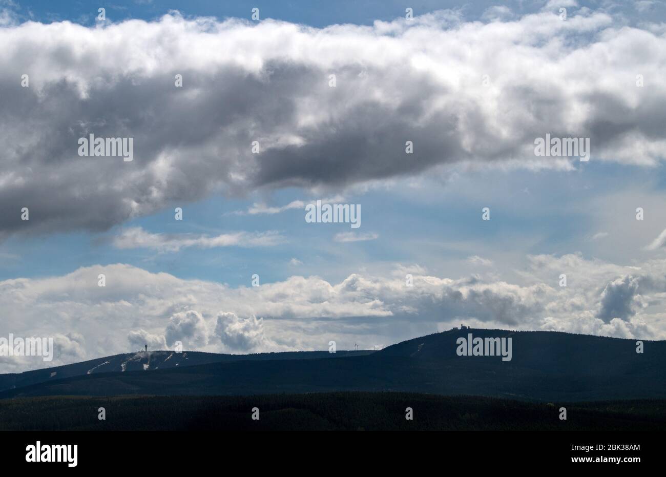 01 May 2020, Saxony, Bärenstein: Mountains of clouds pass over the highest elevations of the Erzgebirge, the Keilberg (1244 meters, l) and the Fichtelberg (1215 meters). Photo: Hendrik Schmidt/dpa-Zentralbild/ZB Stock Photo