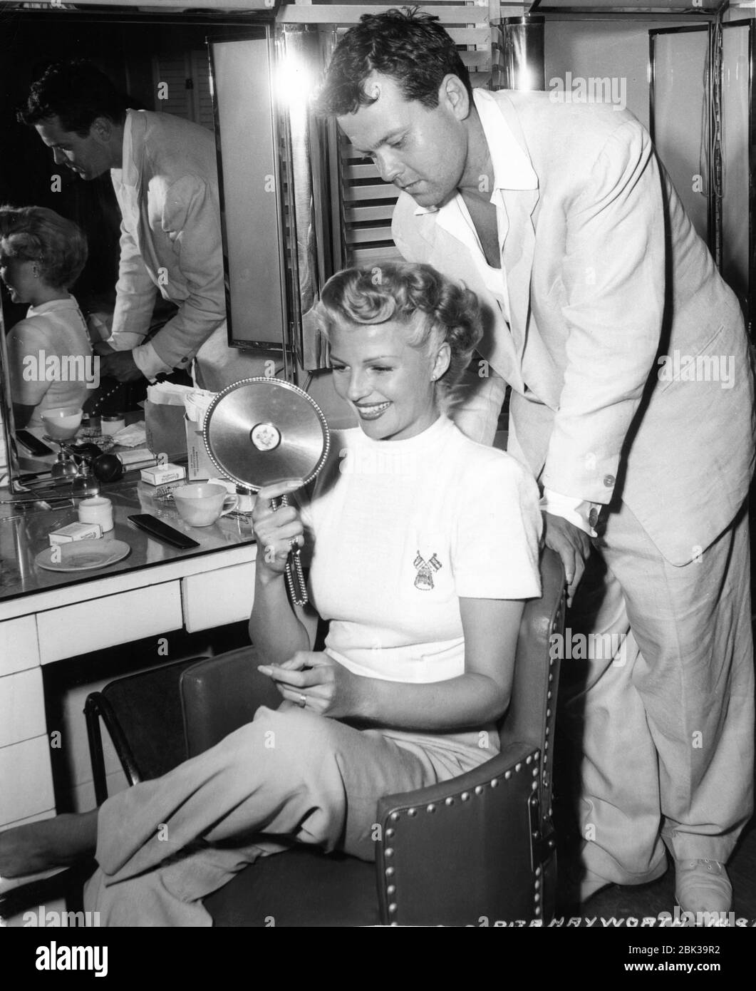 RITA HAYWORTH getting hair cut and dyed blonde candid with ORSON WELLES  during production of THE LADY FROM SHANGHAI 1947 director / screenplay  ORSON WELLES based on novel by Sherwood King gowns