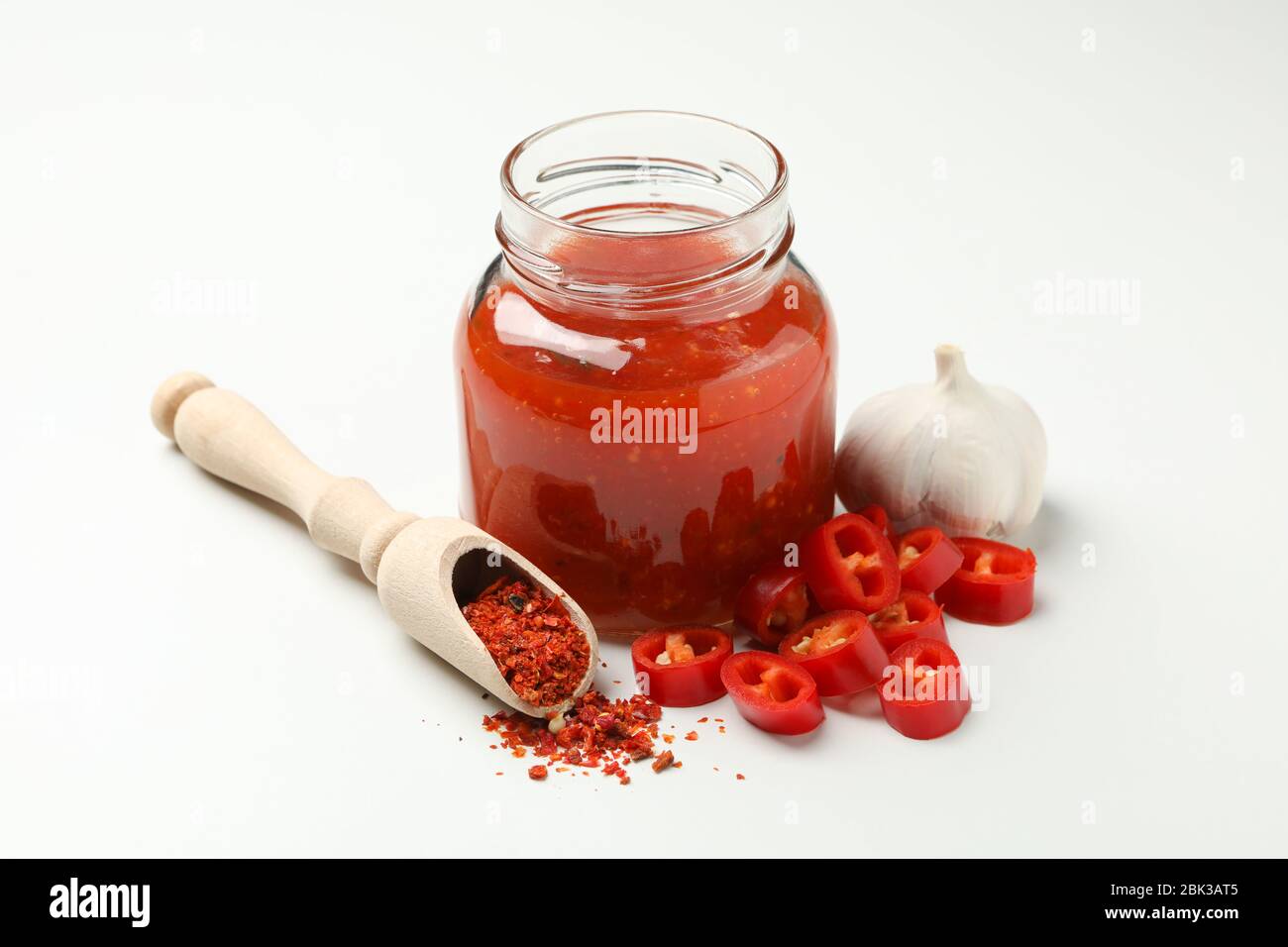 Chilli, garlic, spice and jar with sauce on white background Stock Photo Alamy