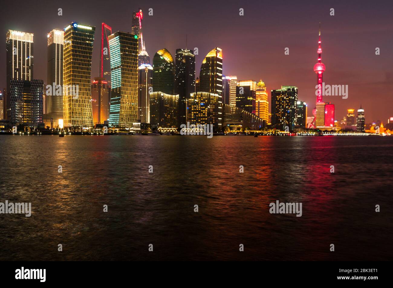 The Pudong skyline at night showing the Oriental Pearl Tower, Shanghai Tower and the Shanghai World Financial Center. The Jinmao Tower can just be mad Stock Photo