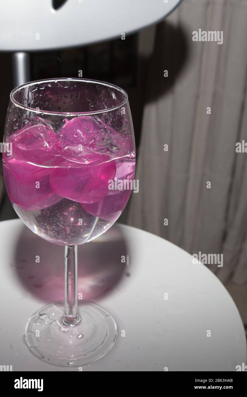 empty glass with ice cubes on white background Stock Photo