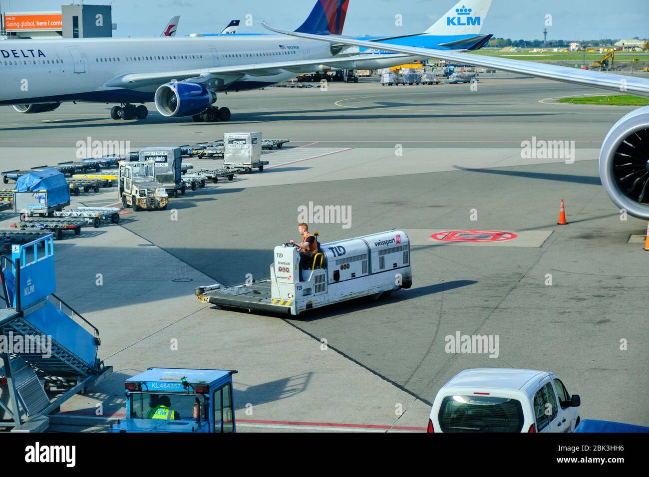 Amsterdam / Netherlands - October 7, 2018: Airport baggage tractor at Amsterdam Airport Schiphol in Amsterdam, Netherlands Stock Photo