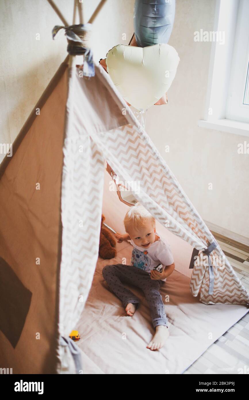 Children's wigwam for a beige boy. In the nursery Stock Photo Alamy