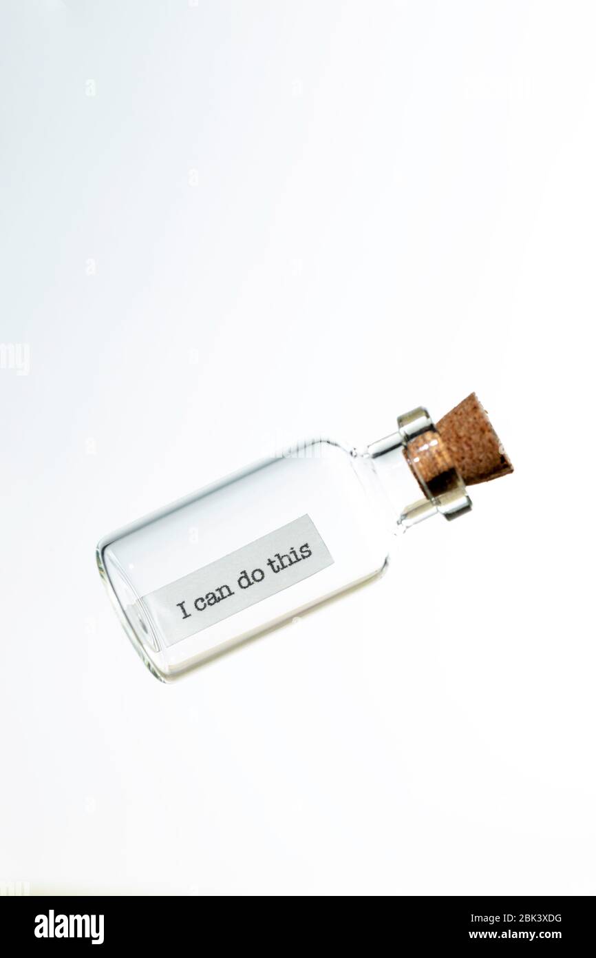 glass bottle with a message inside  and cork tap on a white background Stock Photo