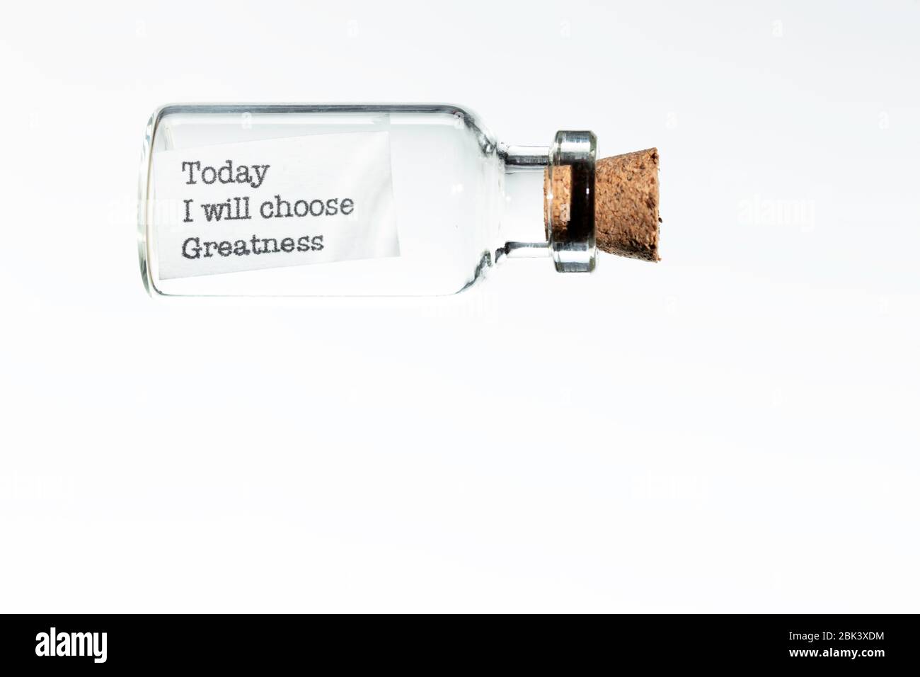 glass bottle with a message inside  and cork tap on a white background Stock Photo