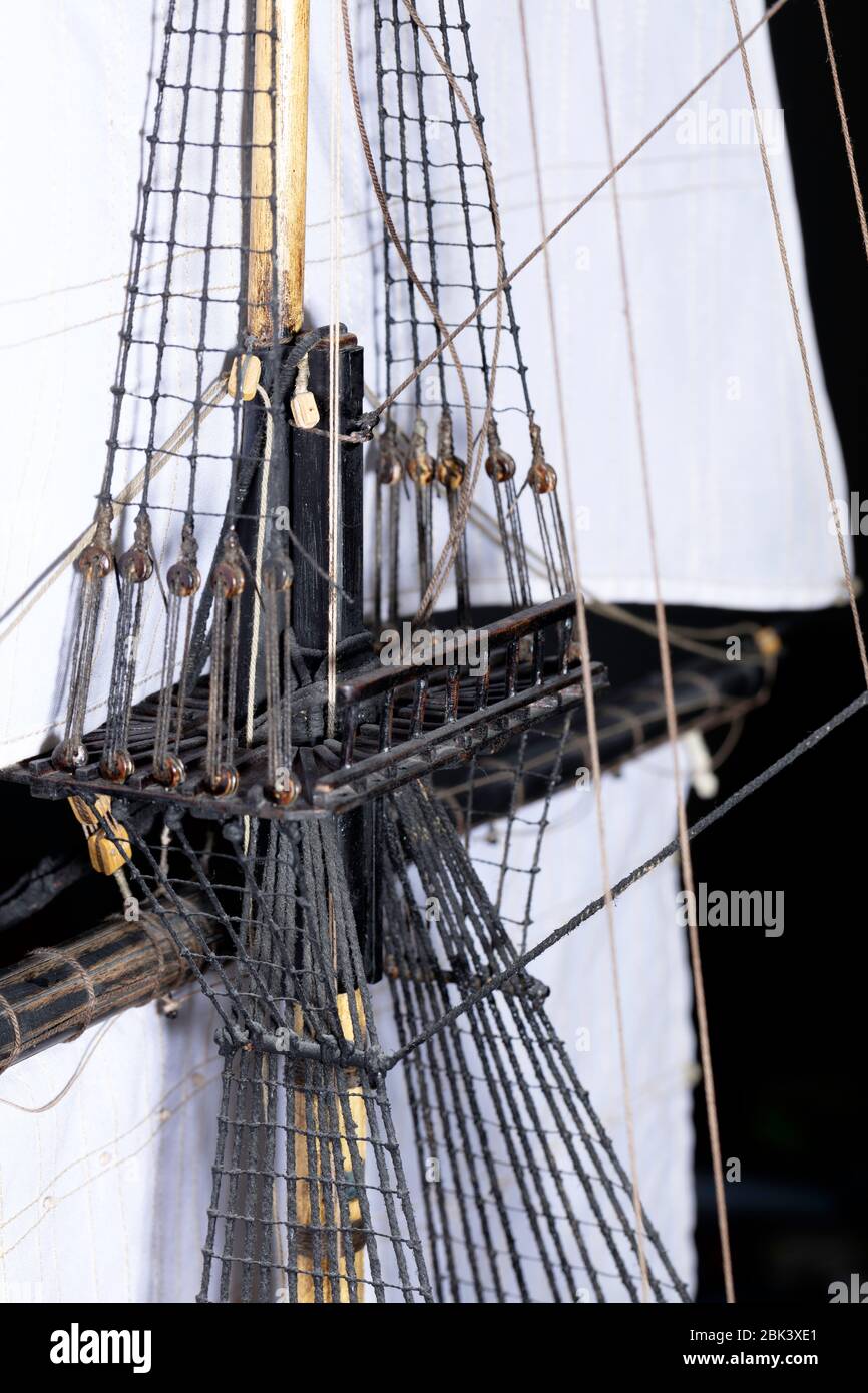 the top of a mast with its rigging and pulleys Stock Photo