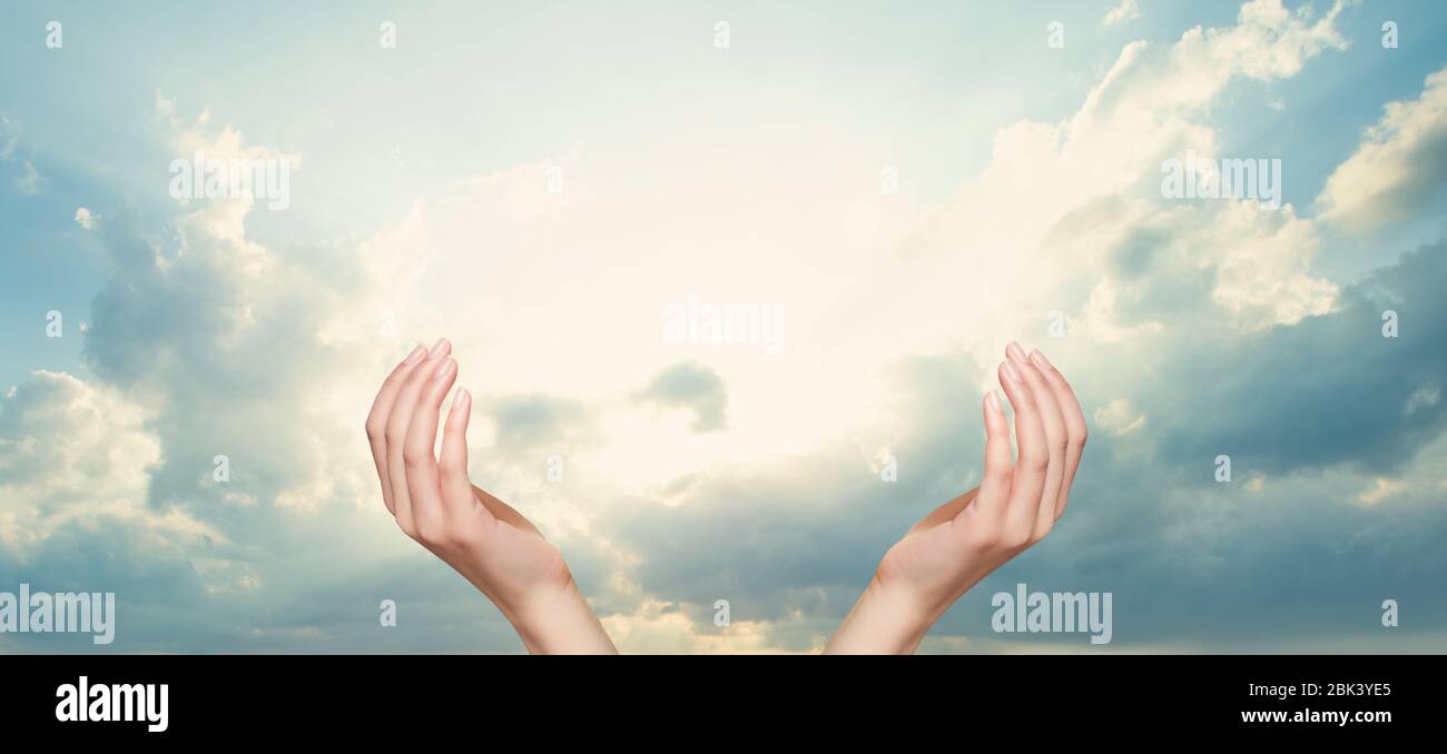 Sky clouds with open hands Stock Photo - Alamy
