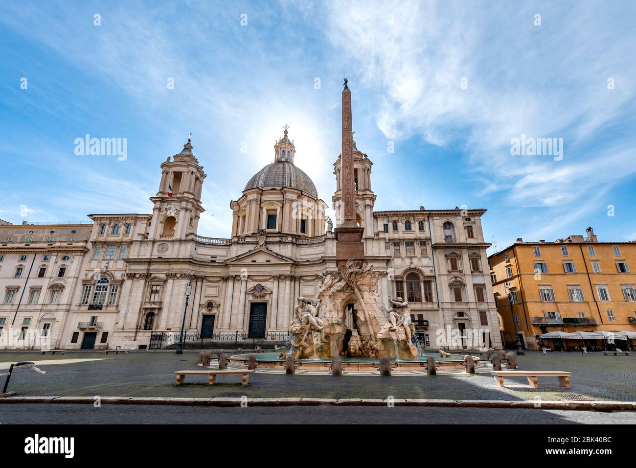 Rome, Italy. 30th Apr, 2020. A view of the fountain of four rivers by Gian Lorenzo Bernini in front of Sant'Agnese church by Francesco Borromini in an and almost desert Navona square during Italy's lockdown due to Covid-19 pandemic. On May 4th will start the phase 2 of the measures against pandemic, adopted by Italian government, that will allow some construction and factory workers to go back to work . Credit: insidefoto srl/Alamy Live News Stock Photo