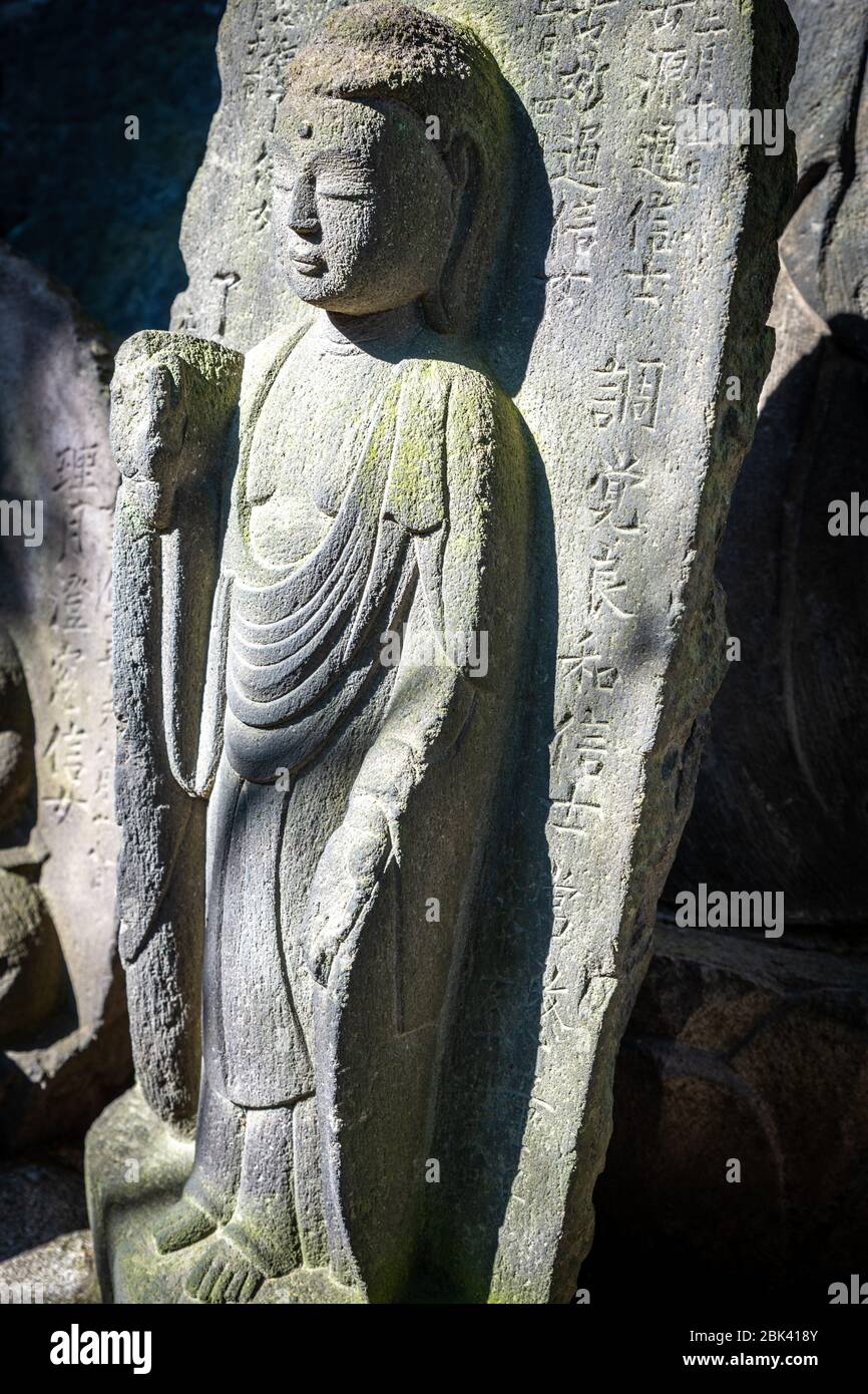 Old Carved Gravestone in Cemetery, Tokyo, Japan Stock Photo