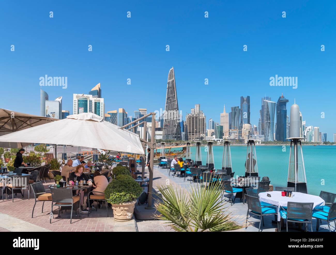 Al Mourjan restaurant on the Corniche with the skyline of the West Bay Central Business District behind, Doha, Qatar, Middle East Stock Photo