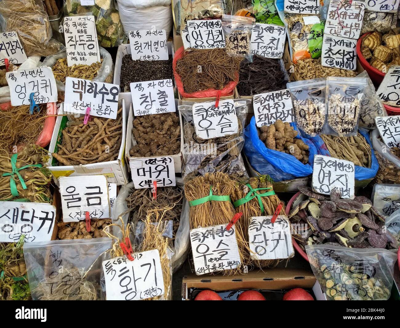 Containers of Korean traditional natural medicine in a street market in