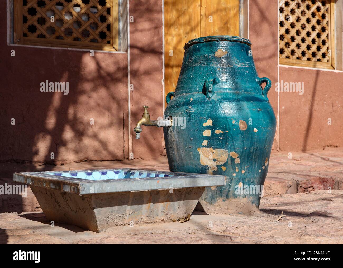 A clay pot water faucet in the village of Abyaneh, Iran,Esfahan Province, Iran,Persia, Middle East Stock Photo
