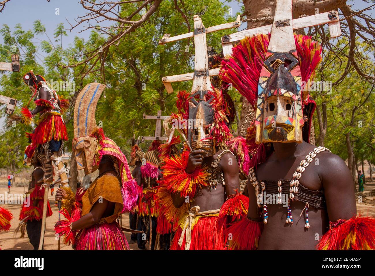 Dogon people (men only) in traditional dance costumes in the village of  Sangha in the Dogon country in Mali, West Africa Stock Photo - Alamy