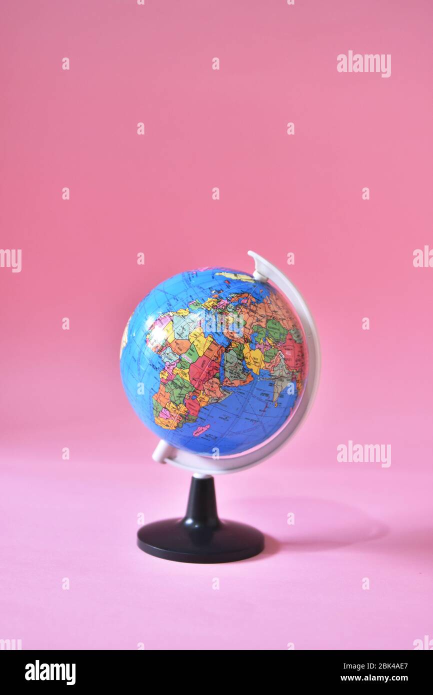 Earth globe isolated on pink background. World health day concept. Stock Photo