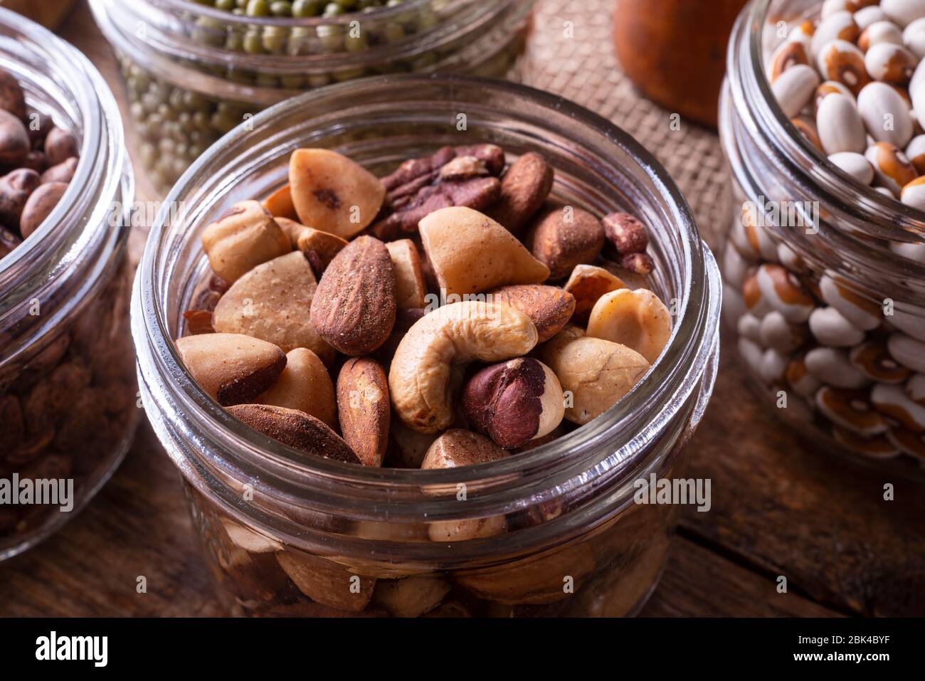 Mixed nuts in a glass storage container Stock Photo Alamy