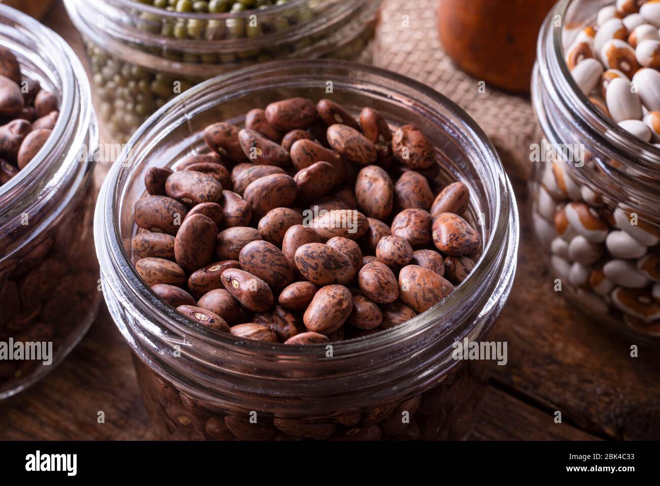 Pinto beans in a glass storage container Stock Photo Alamy