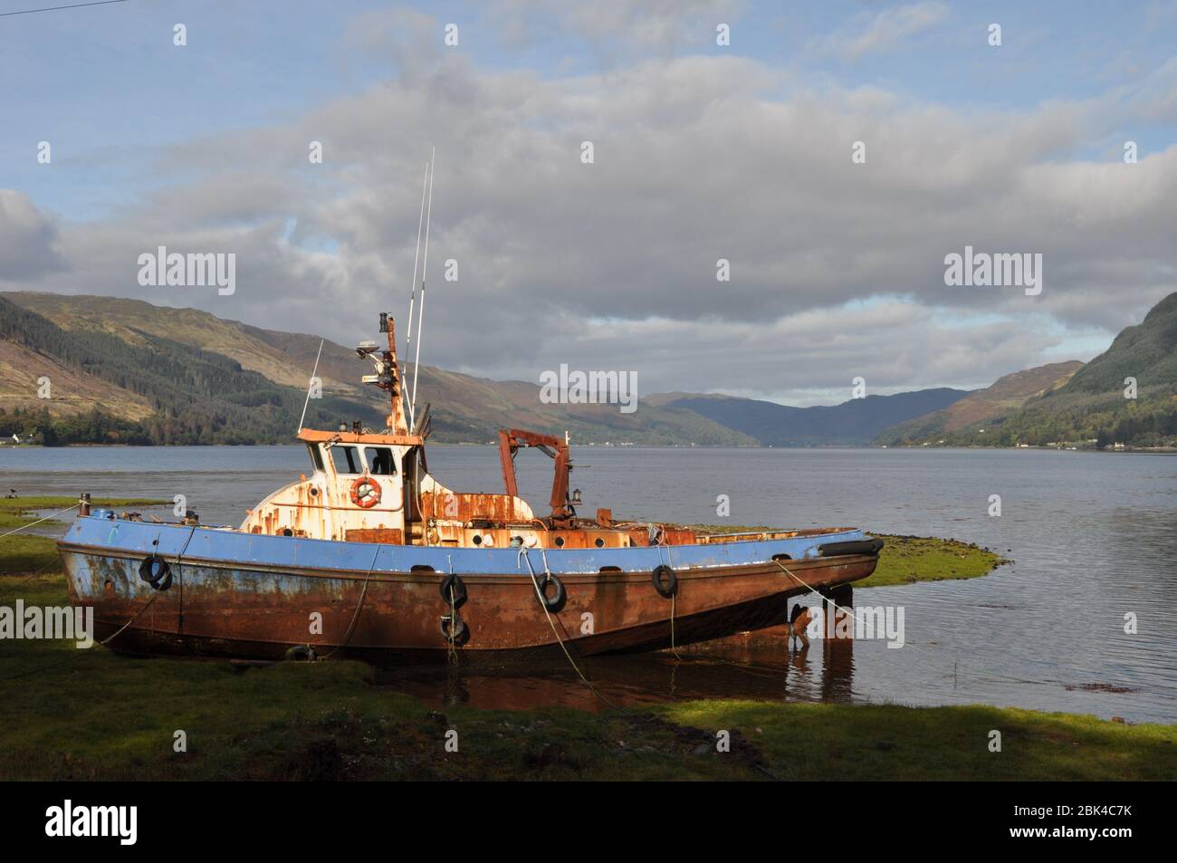 Fishing boat on the shore of Loch Duich at Invershiel, Highland Scotland Stock Photo