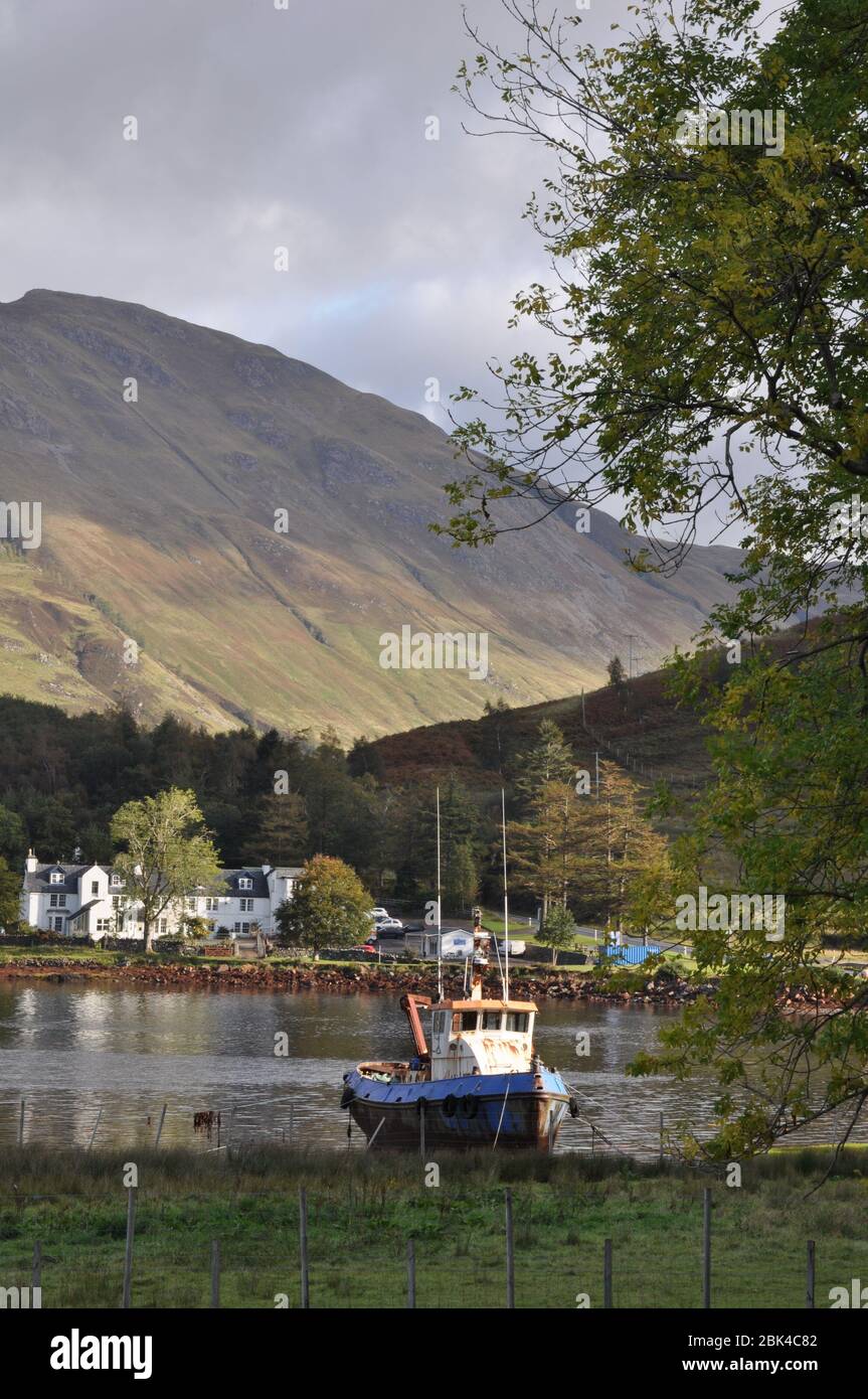 Fishing boat on the shore of Loch Duich at Invershiel, Highland Scotland Stock Photo