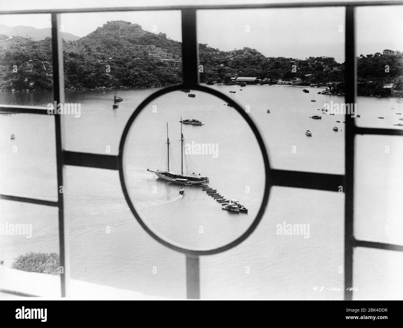 ERROL FLYNN 's Yacht ZACA at anchor in Acapulco Bay in a scene from the film THE LADY FROM SHANGHAI 1947 director / screenplay ORSON WELLES based on novel by Sherwood King gowns Jean Louis Columbia Pictures Stock Photo