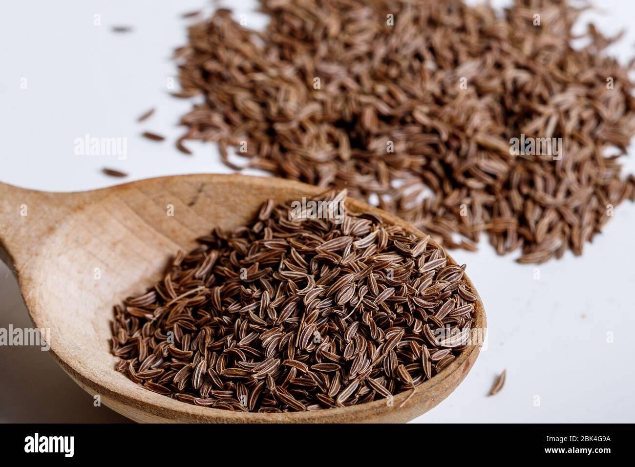 Pile of cumin seeds isolated on white background Stock Photo - Alamy