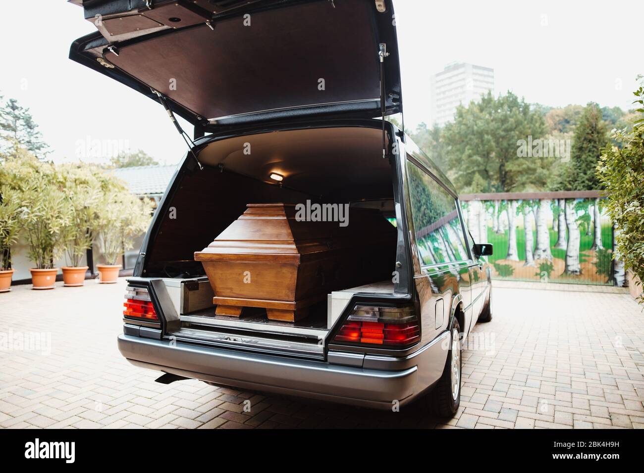 photo of a coffin car at a funeral Stock Photo Alamy