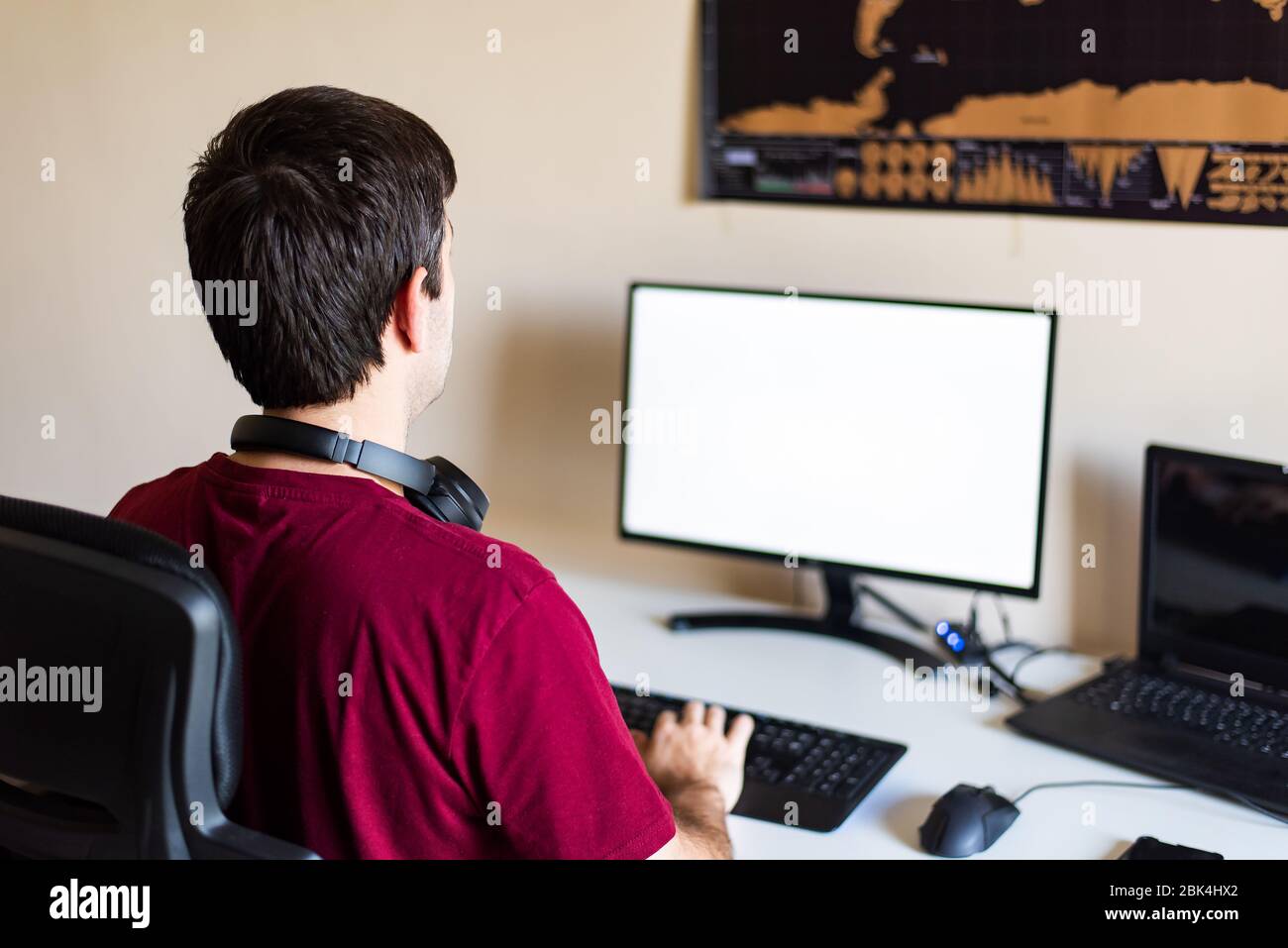 Man working from home in an improvised office in the living room Stock Photo