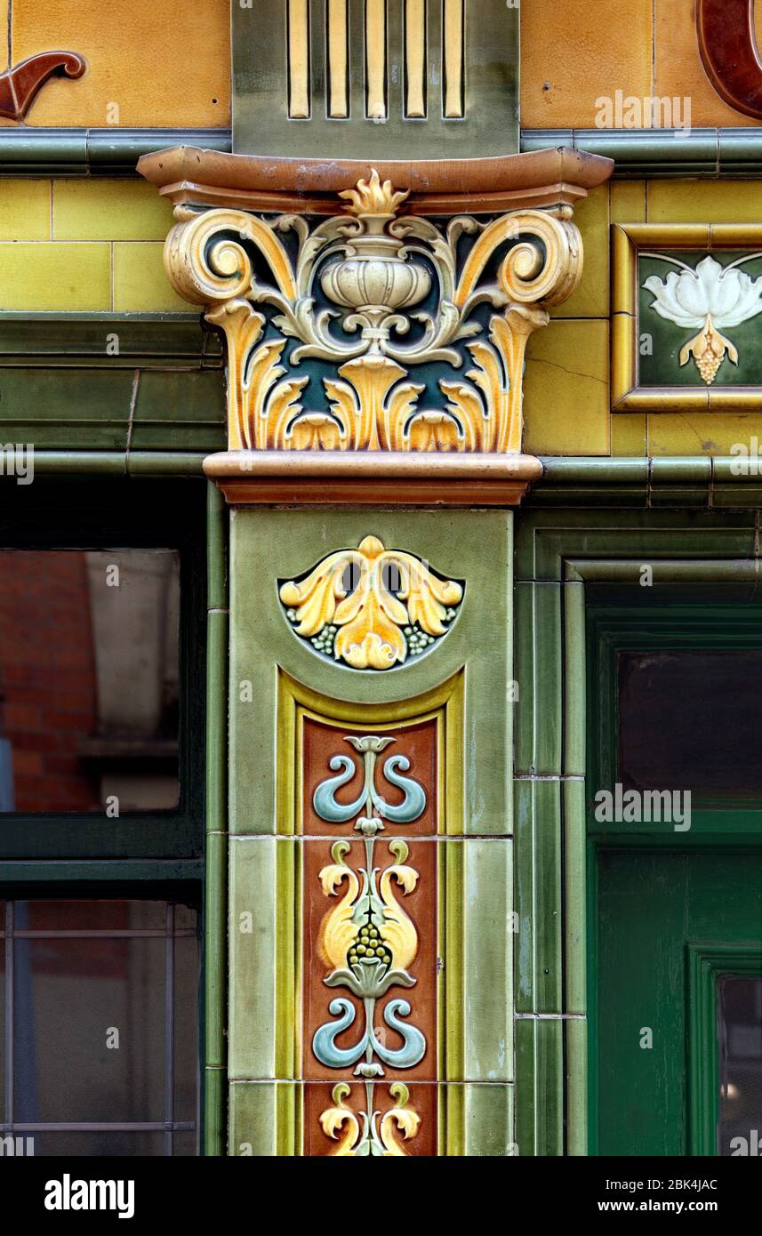 Close up of an ornate pilaster and capital next to one of the entrances to the Peveril of the Peak pub in central Manchester. Stock Photo