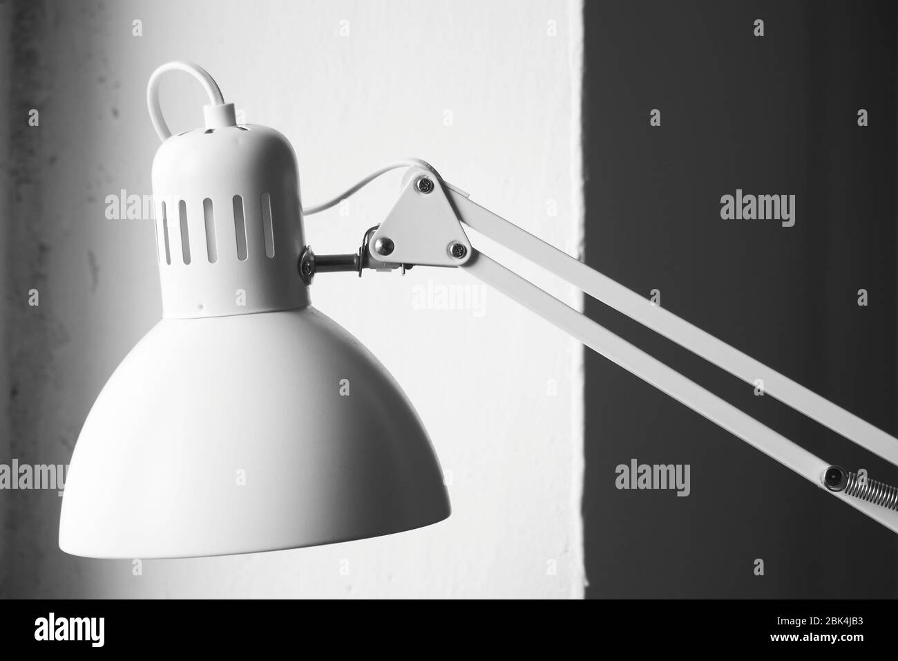White desk lamp on black and white background, BW concept Stock Photo