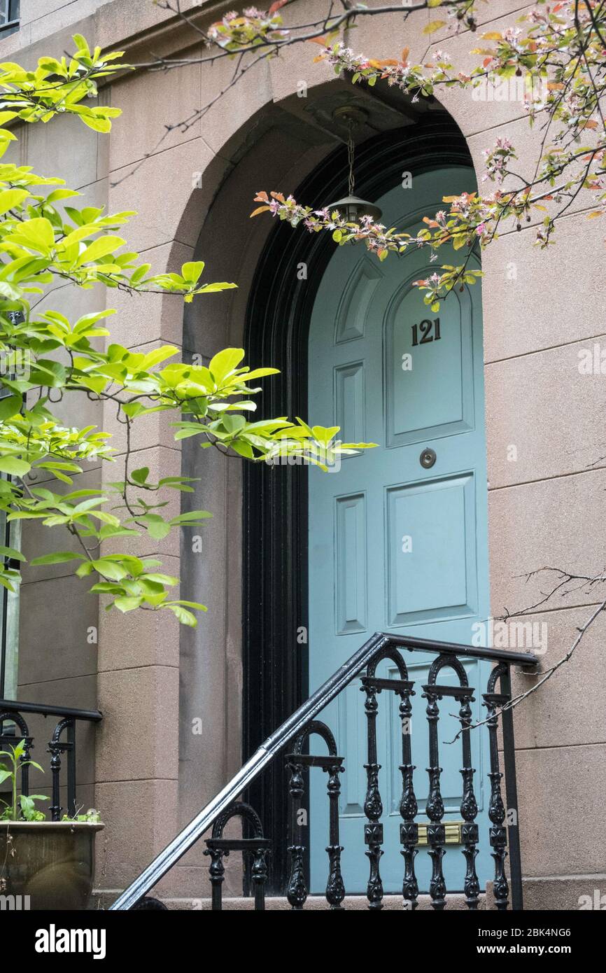 A well-kept brownstone in Murray Hill feature a blue door, New York City, USA Stock Photo