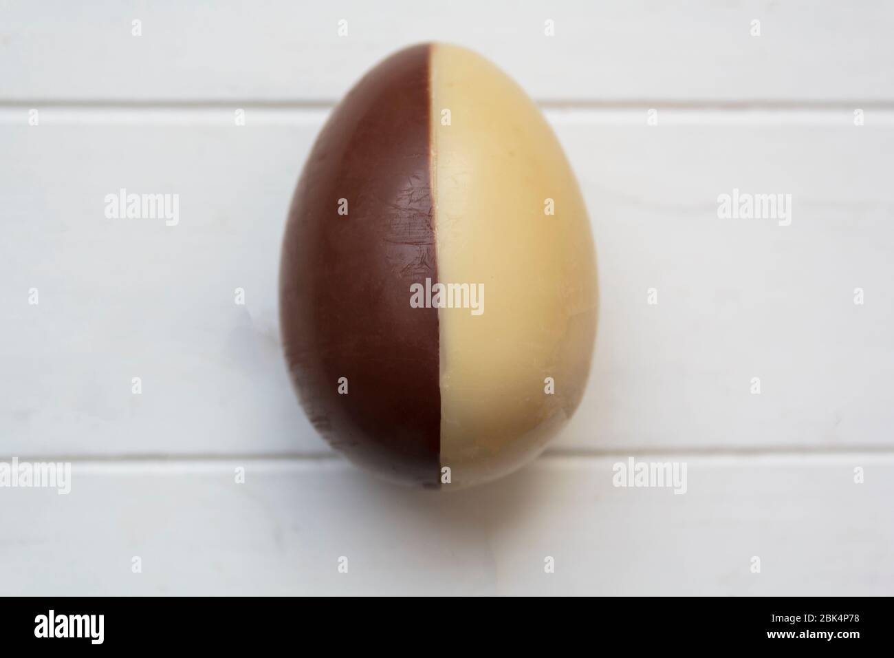 Chocolate Egg Half White And Half Milk Chocolate On White Wooden Table Stock Photo Alamy Chocolate Egg Half White And Half Milk Chocolate On White Wooden Table Stock Photo Alamy
