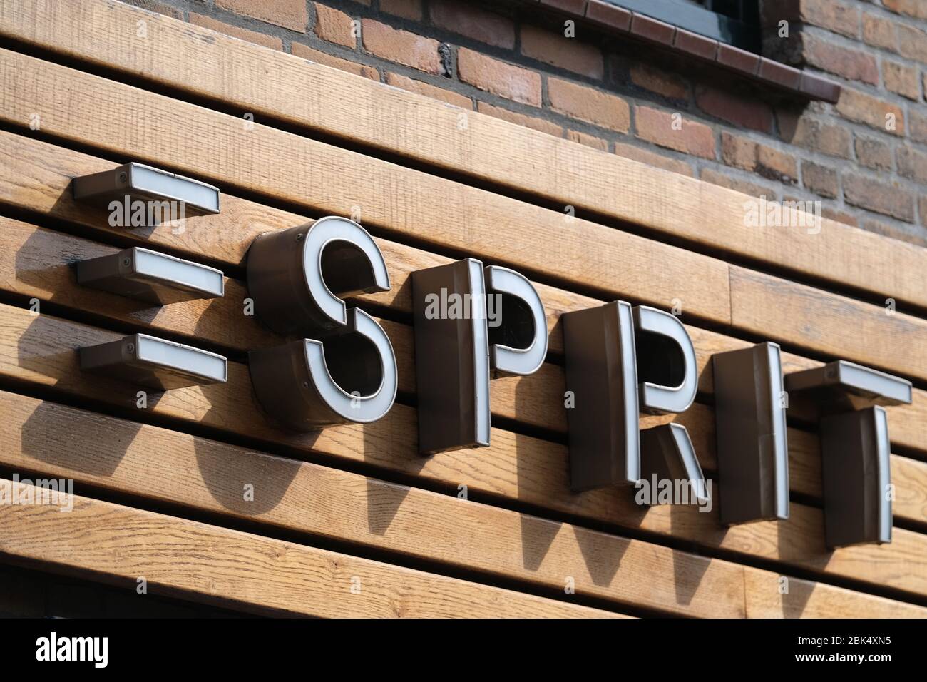 A logo of Esprit is pictured outside its clothing store on April 27, 2020  in Katwijk, Netherlands. The Hong Kong-listed apparel group Esprit will  close its 56 stores in Asia, excluding those