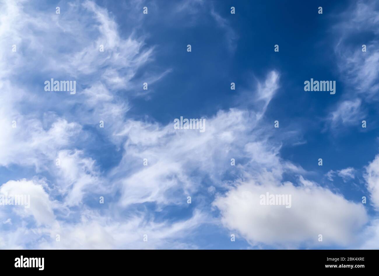 Stunning cirrus cloud formation panorama in a deep blue sky Stock Photo ...