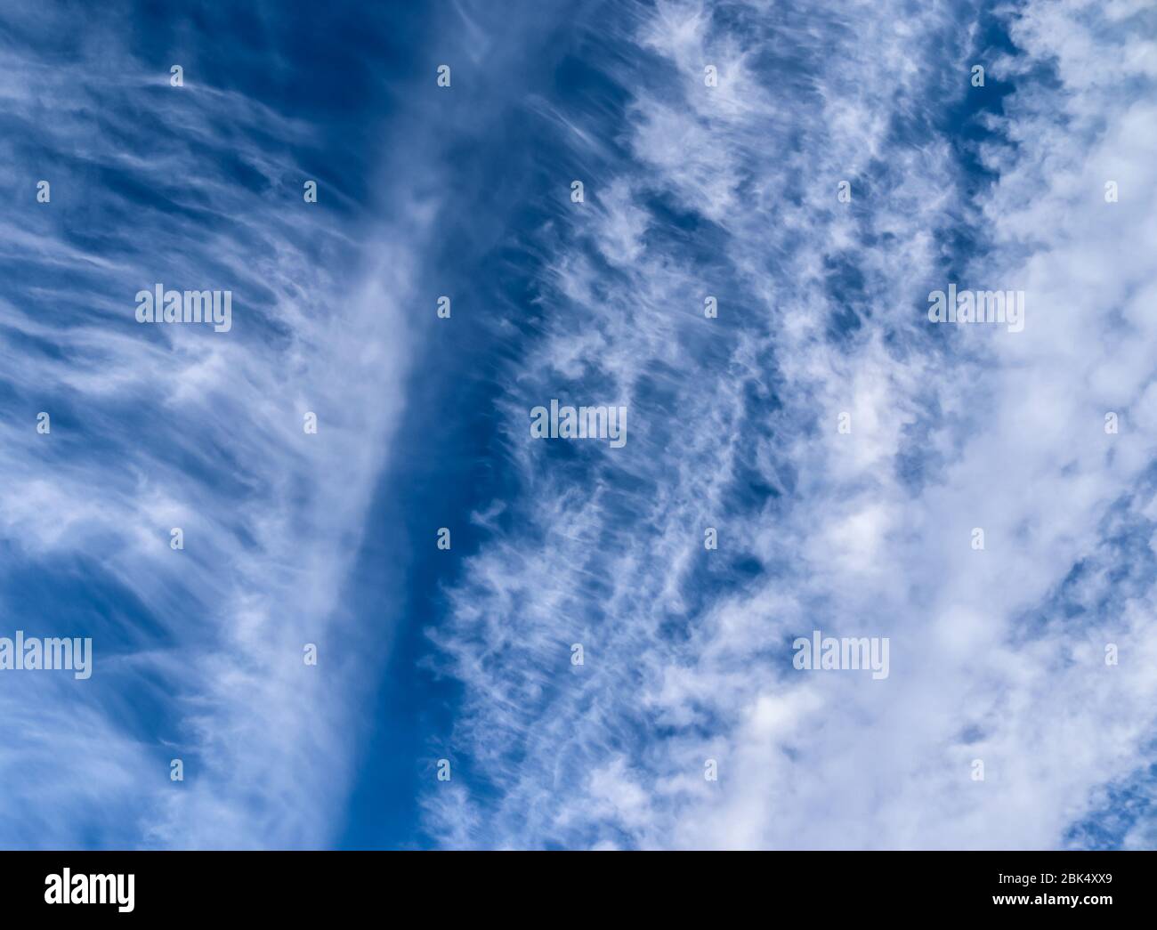 Stunning cirrus cloud formation panorama in a deep blue sky Stock Photo ...