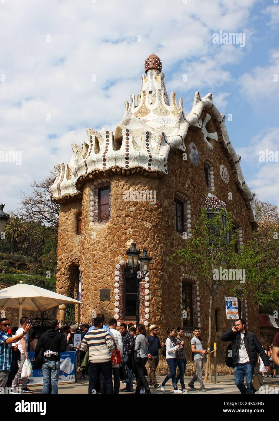 Architectural building with tourists in the Park Güell, located on Carmel Hill in Barcelona, Catalonia, Spain. Architect Antoni Gaudi. Stock Photo