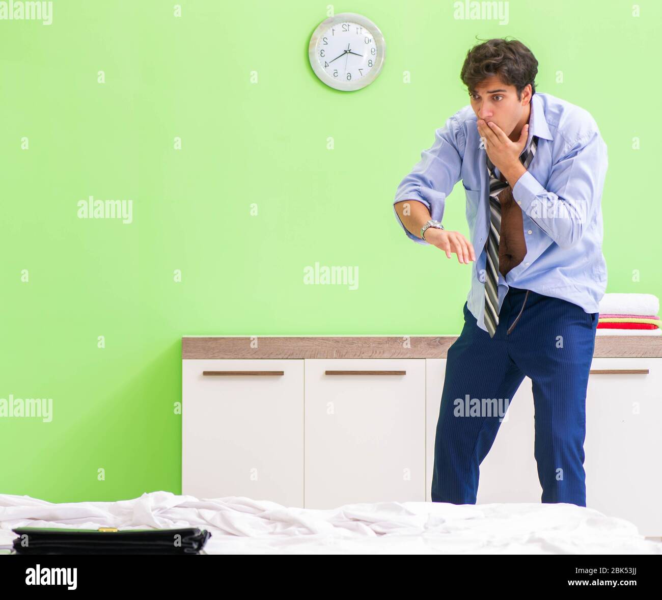 The young businessman employee late for office Stock Photo