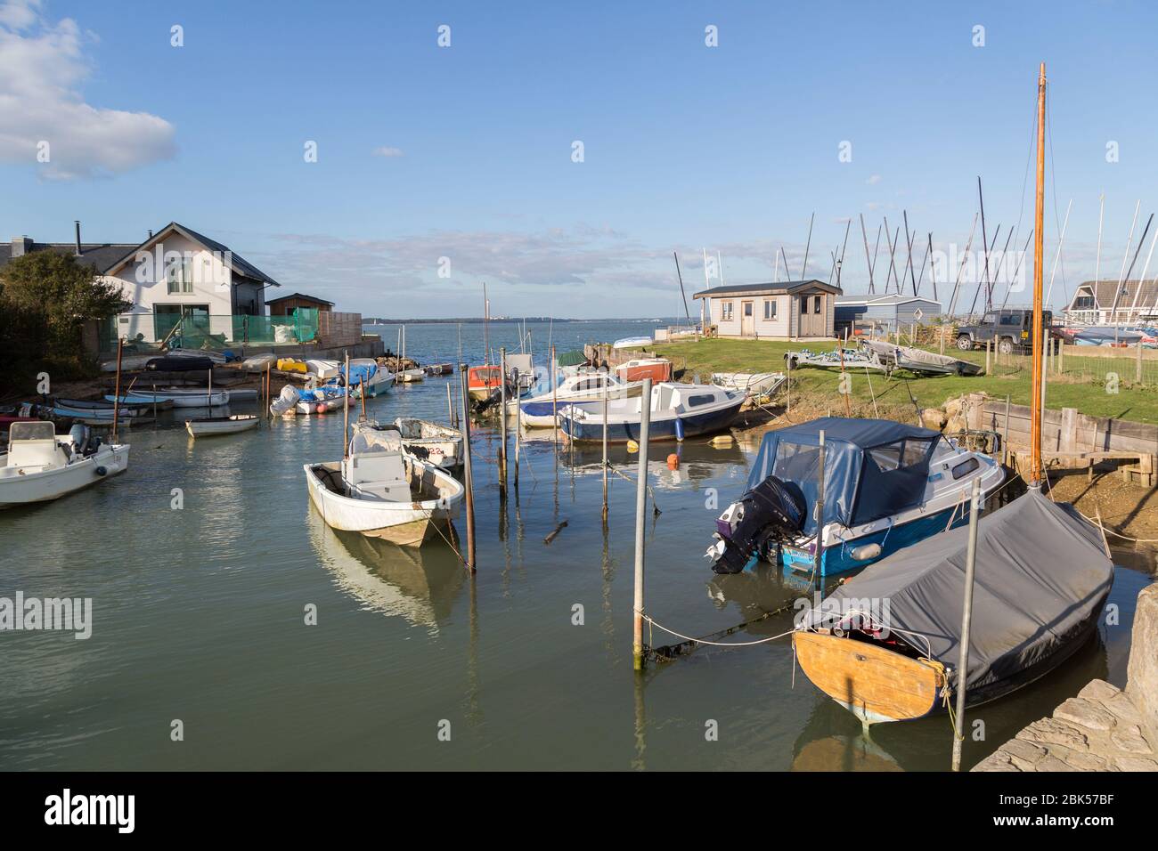 Boats moored in inlet, Gurnard, Isle of Wight, UK Stock Photo