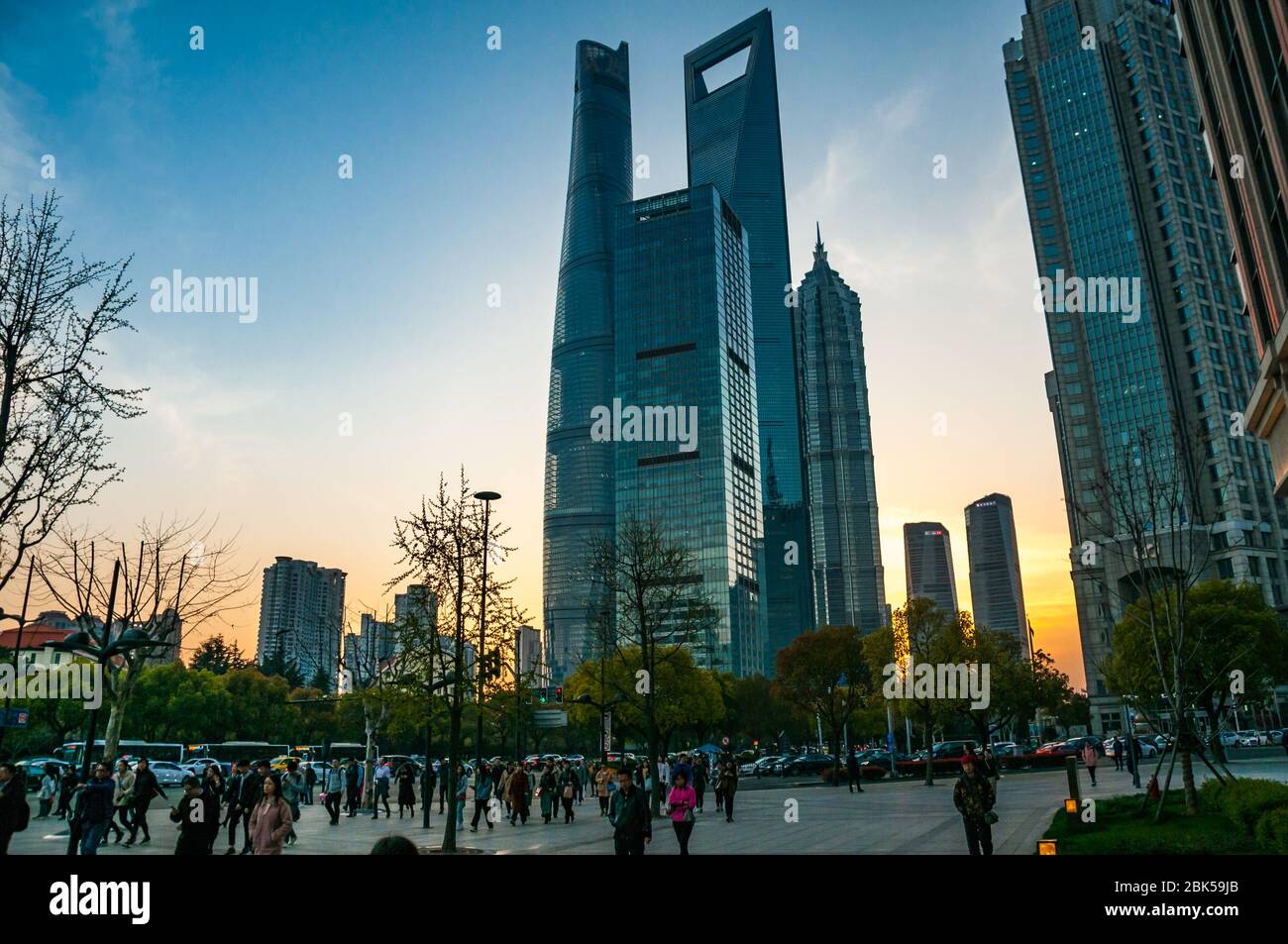 The Shanghai Tower, Jinmao Tower and Shanghai World Financial Center skyscrapers seen at sunset from around Dongchang Road subway station. Stock Photo