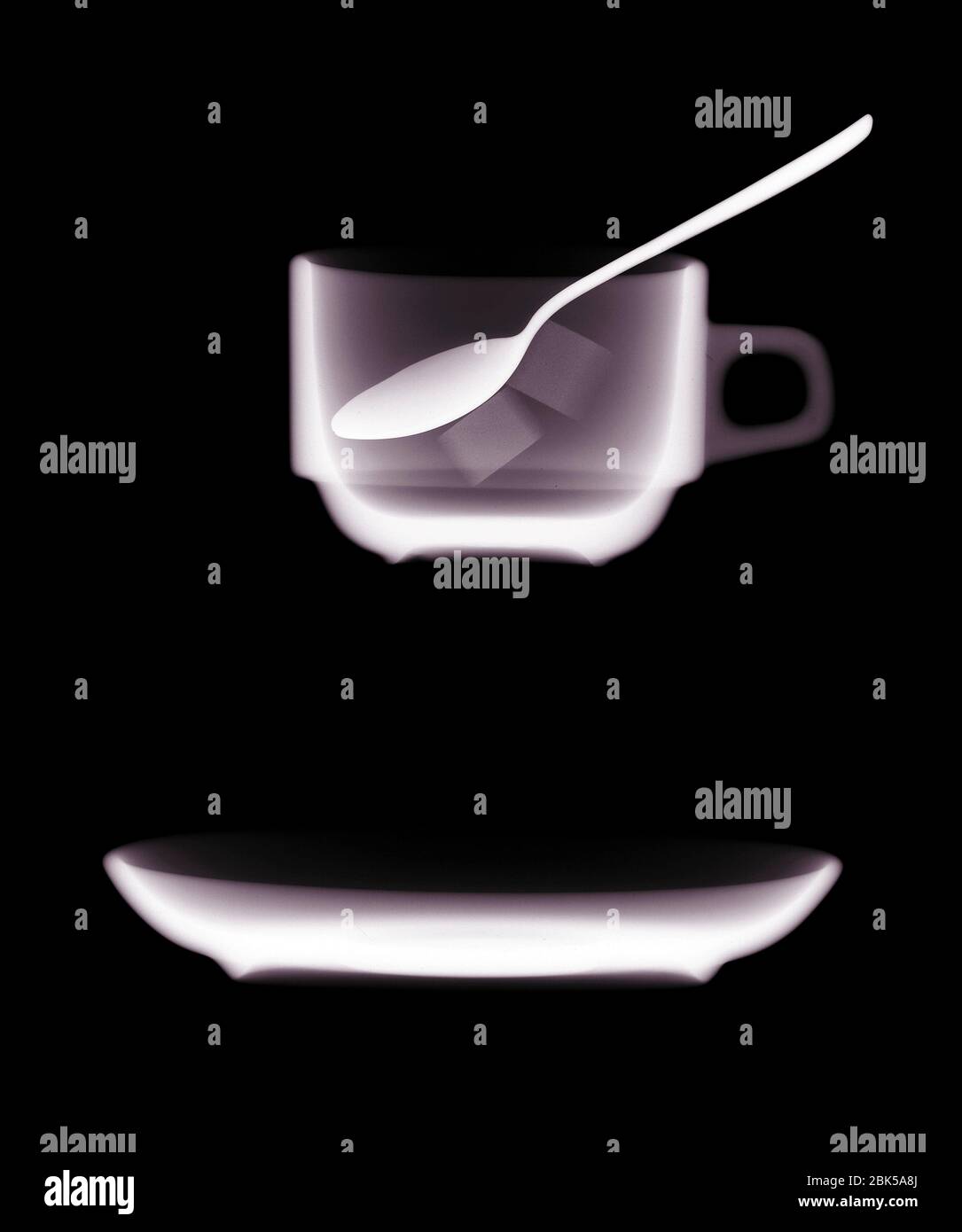Teacup saucer and teaspoon, X-ray. Stock Photo