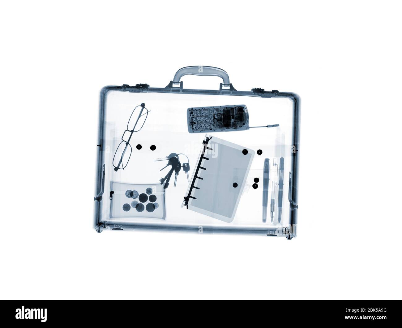Briefcase with various items, X-ray. Stock Photo