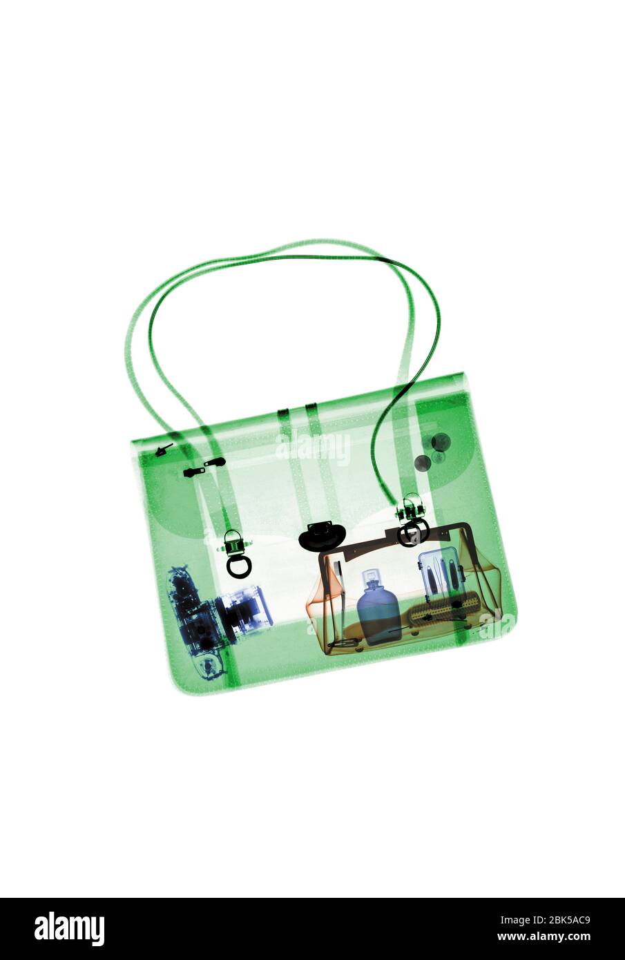Handbag with various items, coloured X-ray. Stock Photo