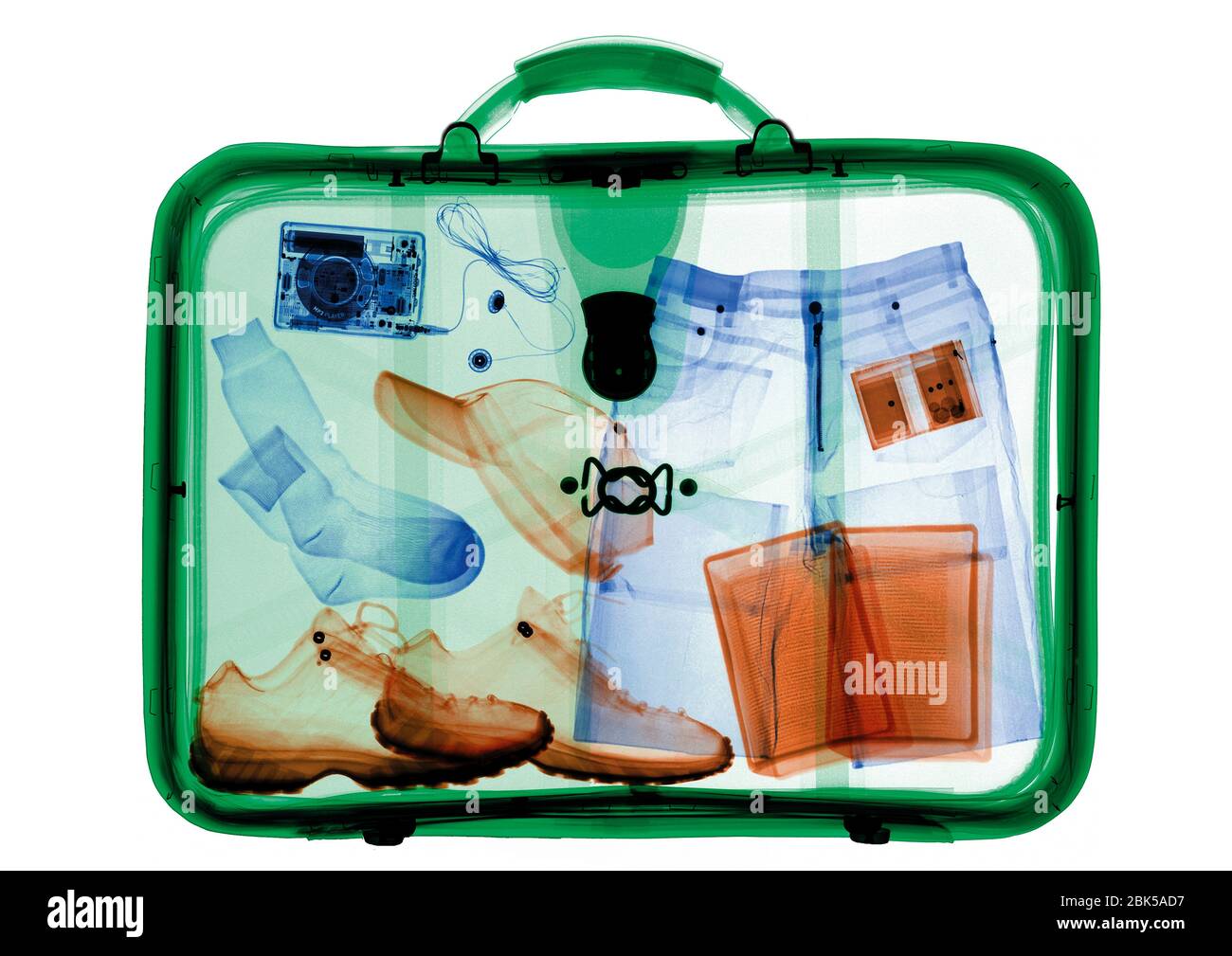 Suitcase packed with clothing, coloured X-ray. Stock Photo