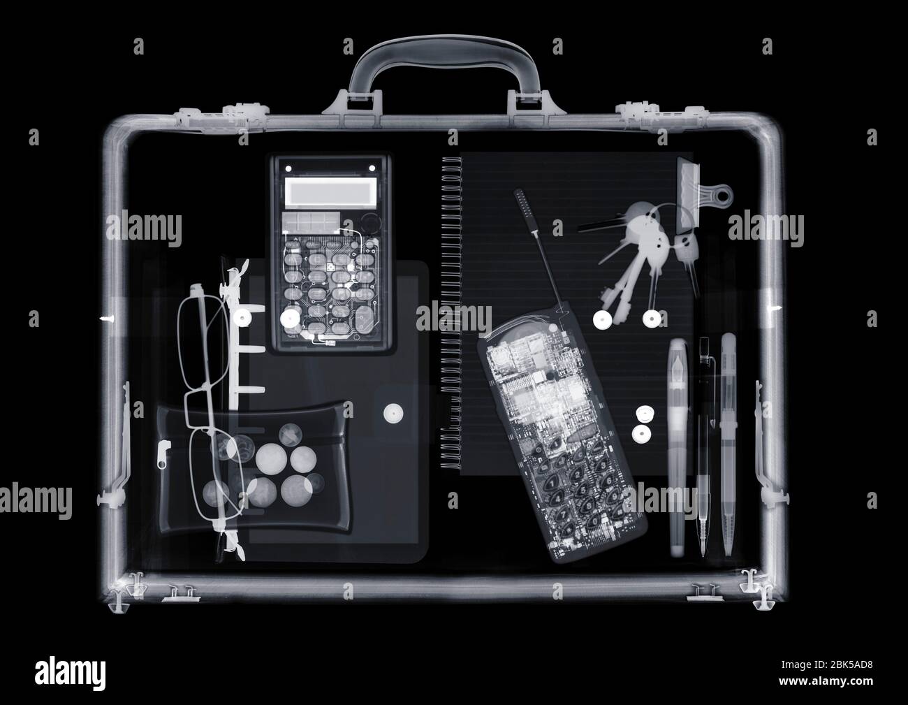 Briefcase with various items, X-ray. Stock Photo
