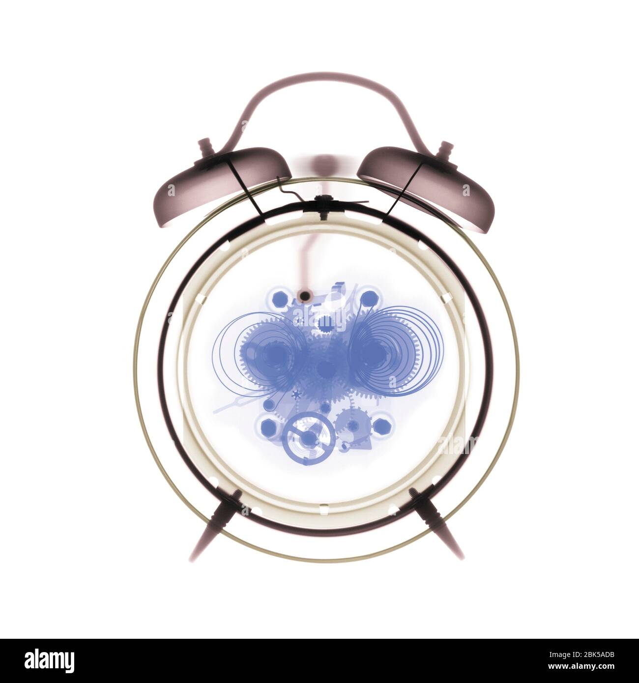 Alarm clock, coloured X-ray. Stock Photo
