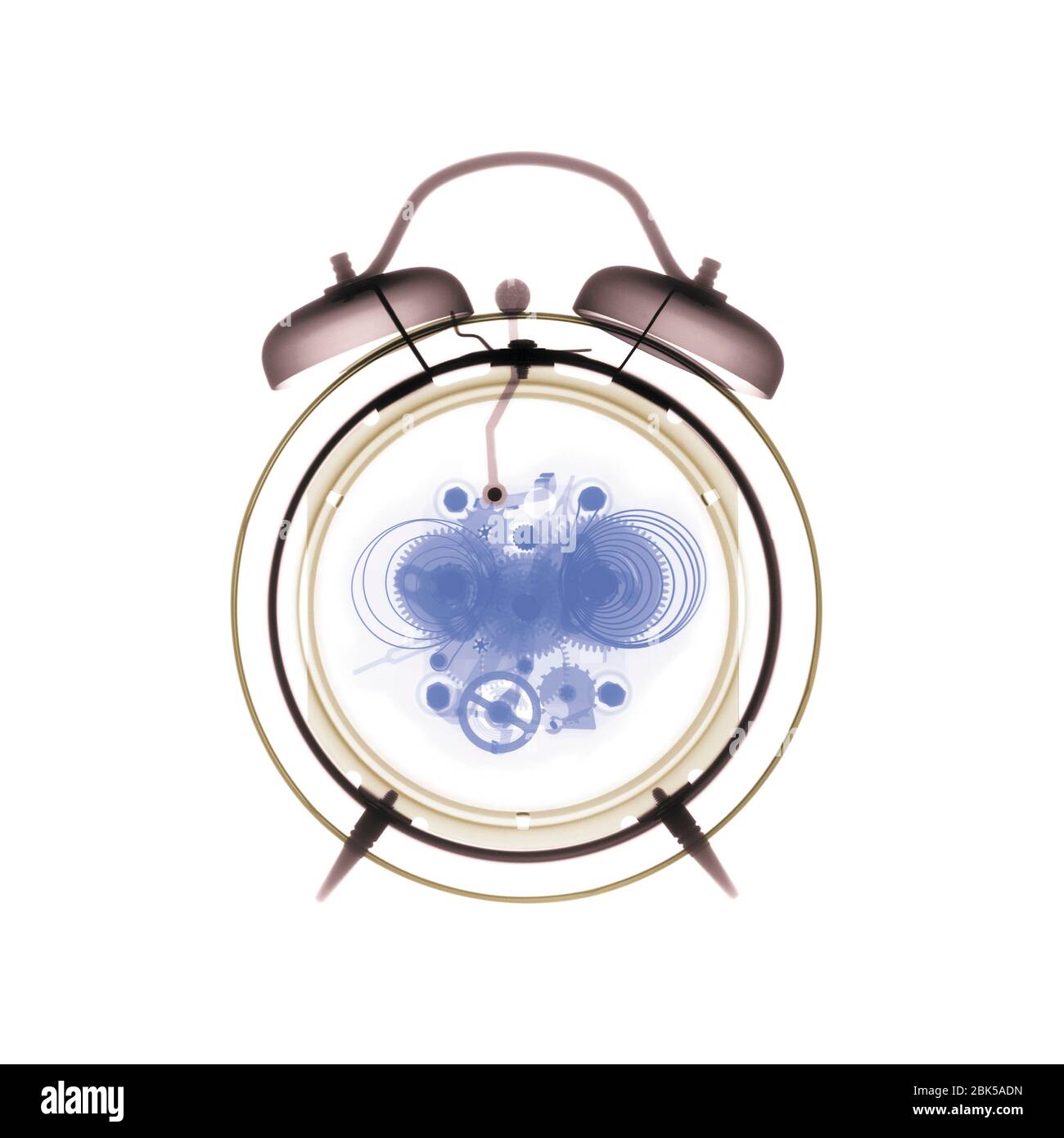 Alarm clock, coloured X-ray. Stock Photo