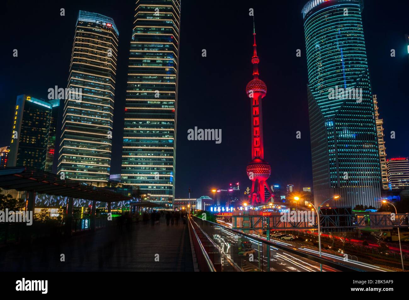 The Oriental Pearl Tower seen at night from the skywalk in Lujiazui in the Pudong New Area of Shanghai, China. Stock Photo