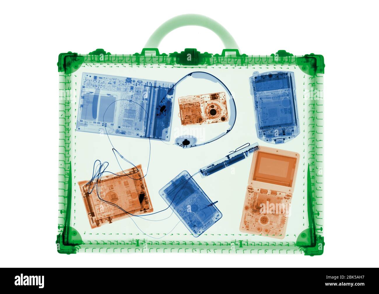 Briefcase and IT accessories, coloured X-ray. Stock Photo
