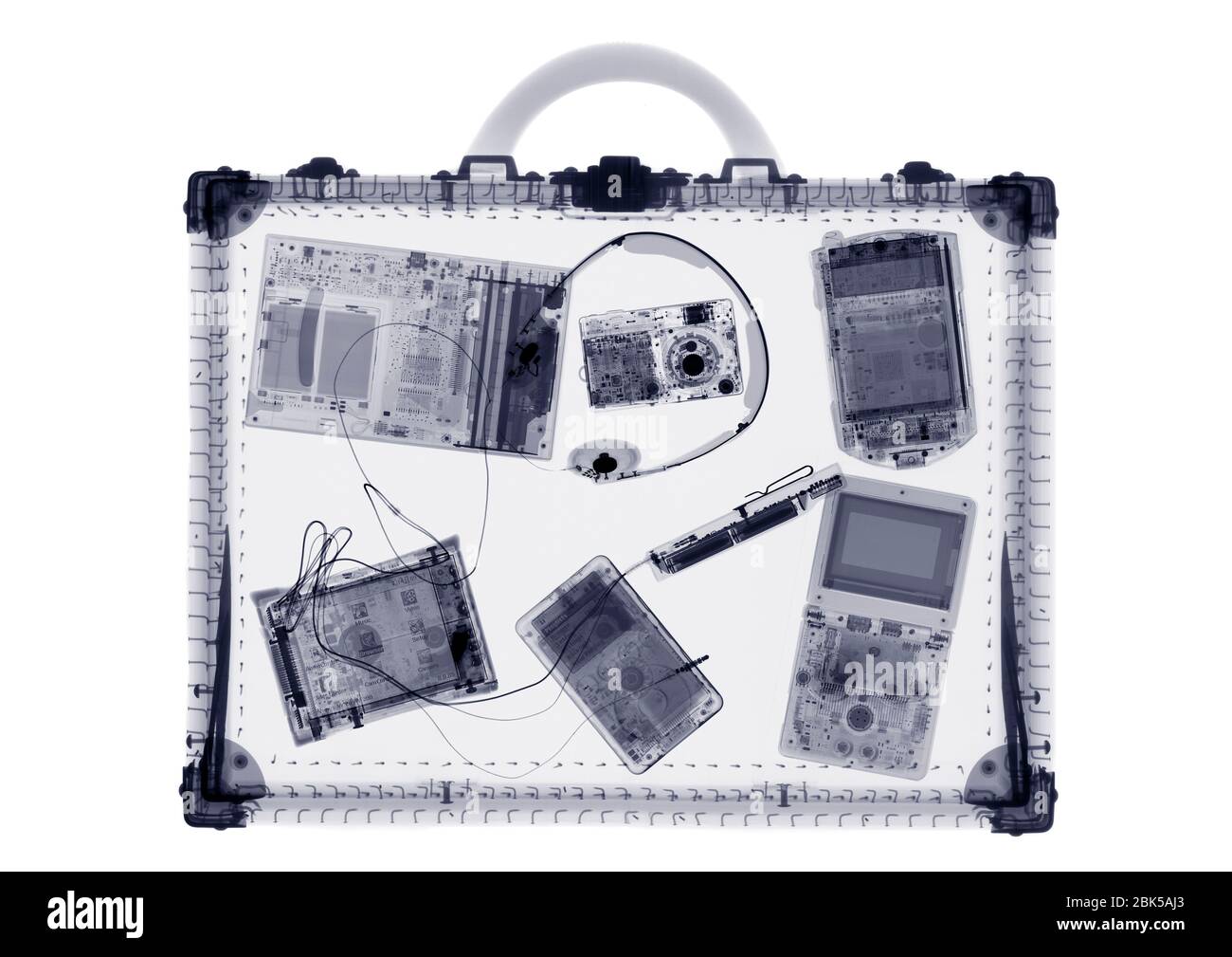 Briefcase and IT accessories, X-ray. Stock Photo