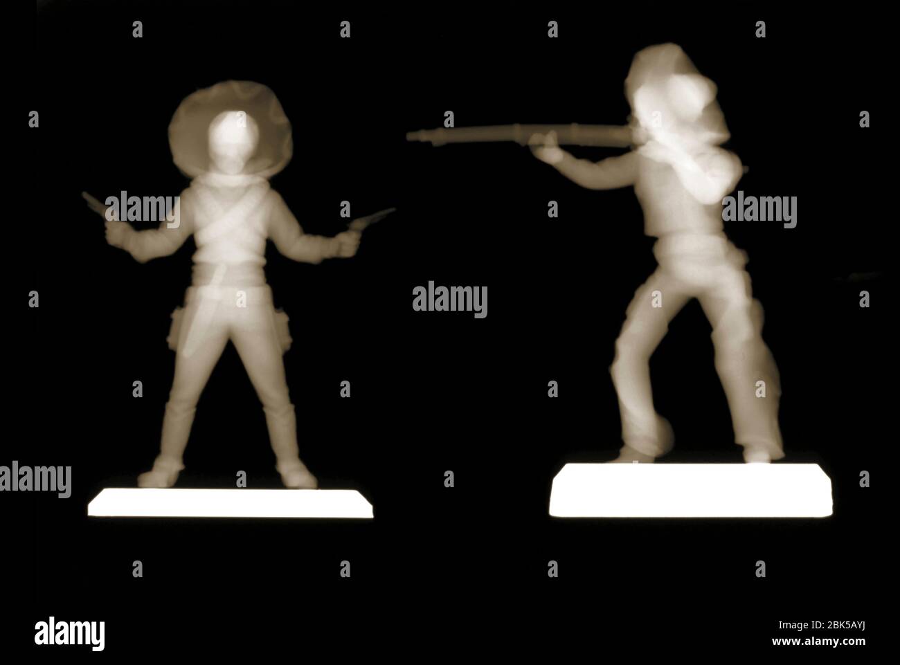Plastic cowboy figures, X-ray. Stock Photo